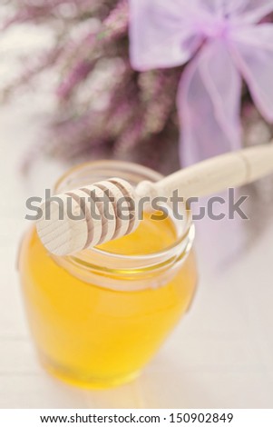 herbal honey in jar with fresh heather - sweet food /shallow DOF/