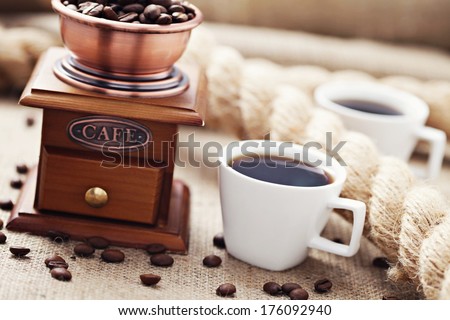 cup of coffee with coffee grinder - coffee time