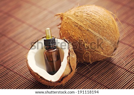 bottle of coconut essential oil - beauty treatment