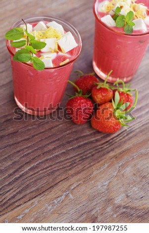 glass of delicious strawberry shake - food and drink