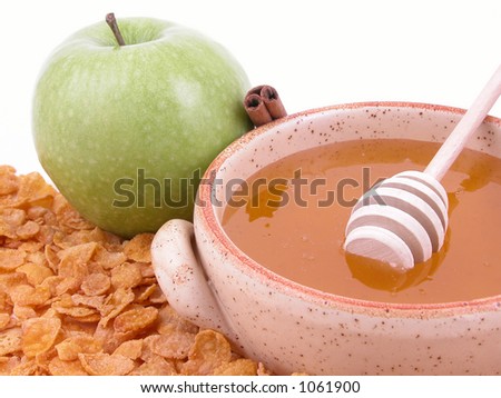 on diet - green apple, cinnamon sticks, honey and corn-flakes (image contains noise)