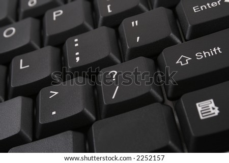 question mark - close-ups on dark keyboard