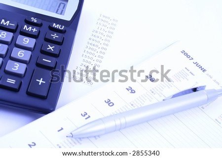year planner - calculator pen and calendar - finance