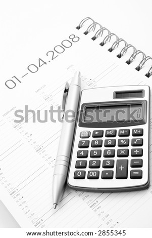 year planner - calculator pen and calendar - finance