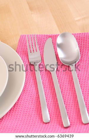 set of knife fork spoon and plated on the table