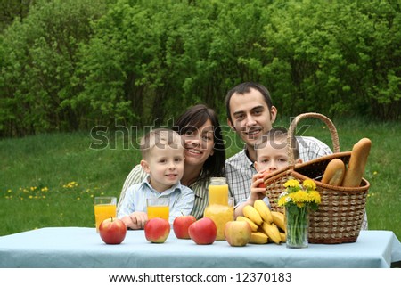 happy family and outdoor picnic