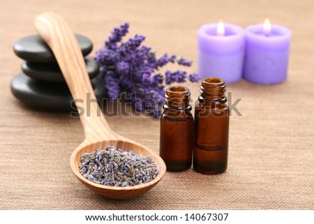 spoon of dry lavender and aromatic lavender oil