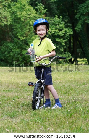 6 years old boy with bike outdoor