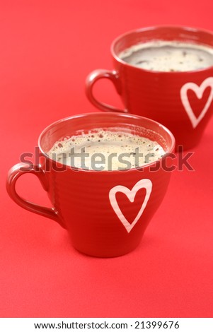 two cups of coffee on red background - food and drink