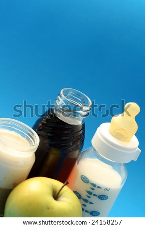 bottle of milk and jar of porridge - baby food