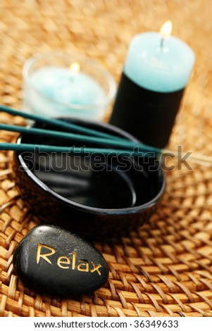 relax pebble and incense sticks - beauty treatment