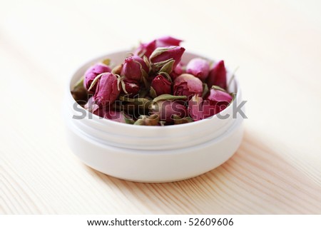 box of natural cream with dry rose flowers - beauty treatment