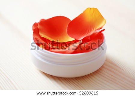box of natural cream with rose petals - beauty treatment