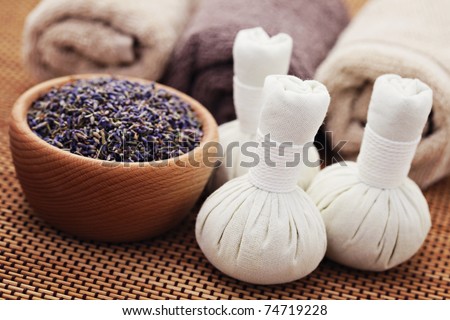 bowl of lavender and massage stamps - beauty treatment