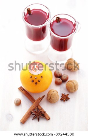 two glasses of hot wine with natural candlestick - food and drink /shallow DOFF/