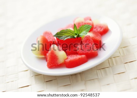 plate of watermelon hearts with mint - fruits and vegetables