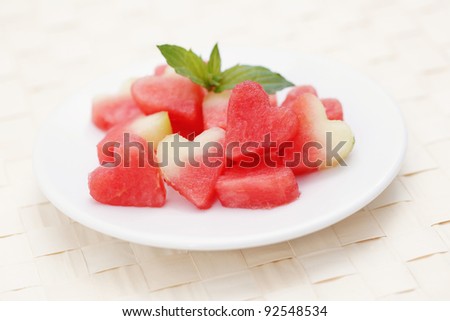 plate of watermelon hearts with mint - fruits and vegetables