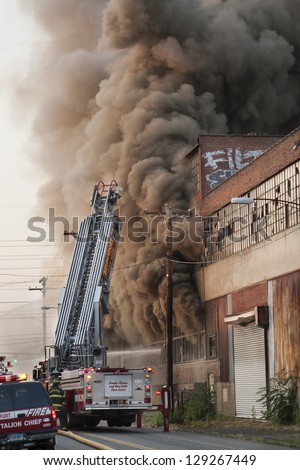 BRIDGEPORT, CT , U.S. - JUNE 21:  The Bridgeport Fire Department battles a large factory fire on Hancock Avenue in Bridgeport, Ct. on June 21, 2012.