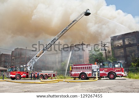 BRIDGEPORT, CT , U.S. - AUGUST 4:  The Bridgeport Fire Department battles a blaze in the vacant Remington Arms Factory in Bridgeport, Ct. on August 4, 2012.