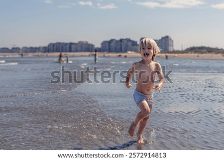 Similar – Image, Stock Photo Cheerful boy running through park