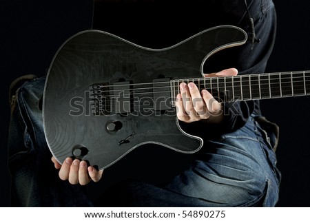 In the hands of a man regarded as an electric guitar