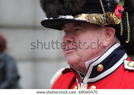 LONDON, ENGLAND - NOVEMBER 12: An unidentified gentleman dressed in historical English military uniform at Lord Mayor\'s Show on November 12, 2010. The Lord Mayor\'s Show is an 800-year-old yearly event.