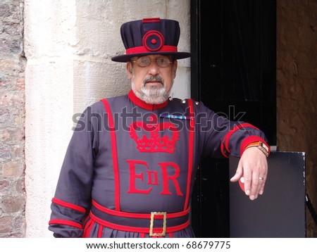 TOWER OF LONDON, LONDON, UK - AUGUST 24: Yeoman of the guard on duty at the Tower of London, UK on the August 24, 2010. The Yeoman of the Guard, also called Beefeaters, protect the crown jewels.