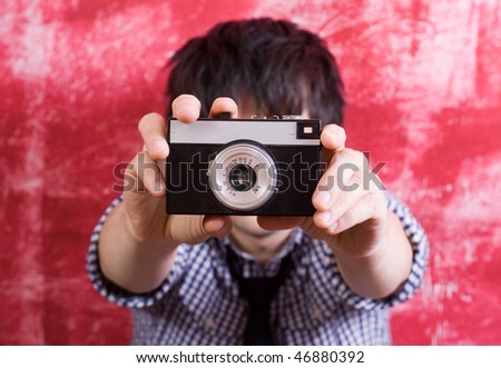 Photographer making shot with vintage film camera