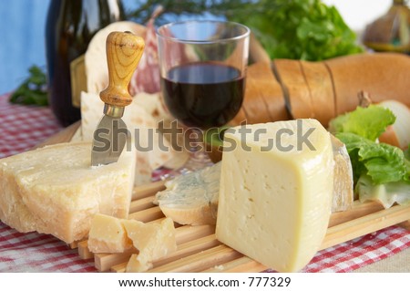 Gorgonzola, parmigiano, pecorino cheese, with wine and bread, typical Italian food, Piacenza