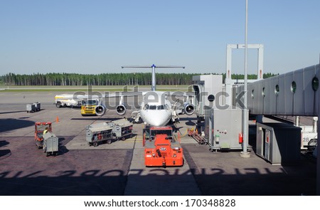 Helsinki, Finland - JUNE 07, 2011: airplane docked in Helsinki International Airport on June 07, 2011 in Finland. Helsinki Airport is the main airport of the Helsinki and the whole of Finland