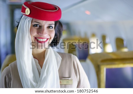 DUBAI - FEB 13: Emirates crew member in Boeing 777-300ER aircraft on February 13, 2013 in Dubai, UAE. Emirates handles major part of passenger traffic and aircraft movements at the airport.