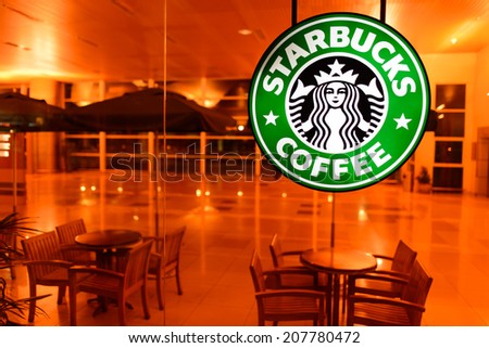 KUCHING - MAY 02: airport cafe interior on May 02, 2014 in Kuching, Malaysia. Starbucks is the largest coffeehouse company in the world, with 23,187 stores in 64 countries