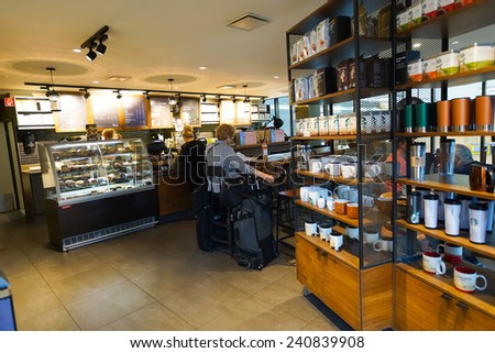 GENEVA - SEP 11: Starbucks cafe interior at train station on September 11, 2014 in Geneva, Switzerland. Starbucks is the largest coffeehouse company in the world, with more then 23000 stores