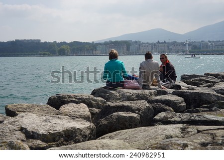 GENEVA - SEP 11: people rest near Geneva lake on September 11, 2014 in Geneva, Switzerland. Geneva is the second most populous city in Switzerland and is the most populous city of Romandy