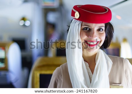 DUBAI - FEB 13: Emirates crew member in Boeing 777-300ER aircraft on February 13, 2013 in Dubai, UAE. Emirates handles major part of passenger traffic and aircraft movements at the airport.