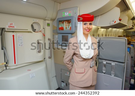 DUBAI - NOV 12: Airbus A380 crew member on November 12, 2014 in Dubai, UAE. Emirates handles major part of passenger traffic and aircraft movements at the airport.