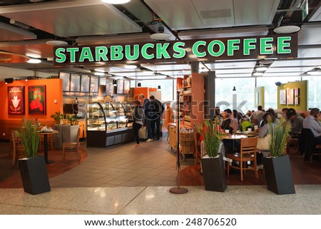 GENEVA - SEP 11: Starbucks cafe interior on September 11, 2014 in Geneva, Switzerland. Starbucks is the largest coffeehouse company in the world, with more then 23000 stores