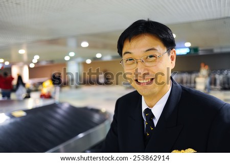 MOSCOW - OCTOBER 12, 2010: Cathay Pacific pilot in Domodedovo airport. Cathay Pacific is the flag carrier of Hong Kong, with its head office and main hub located at Hong Kong International Airport.