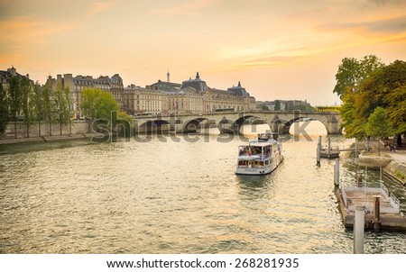PARIS - SEPTEMBER 06, 2014: The Seine river in the evening. The Seine is a 776 km long river and an important commercial waterway within the Paris Basin in the north of France