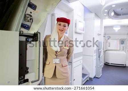 DUBAI, UAE - MARCH 10, 2015: Emirates Airbus A380 crew member. Emirates handles major part of passenger traffic and aircraft movements at the airport.