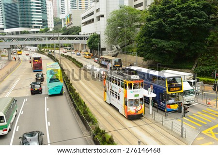HONG KONG - MAY 05, 2015: double-decker tram on street of HK. Hong Kong Tramways is a tram system in Hong Kong, being one of the earliest forms of public transport in the metropolis.