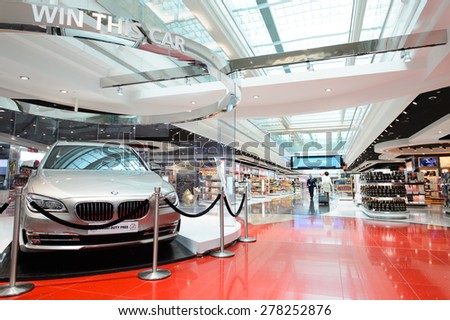 DUBAI - MARCH 10, 2015: Dubai duty-free shopping area interior. Dubai International Airport is the primary airport serving Dubai and is the world\'s busiest airport by international passenger traffic