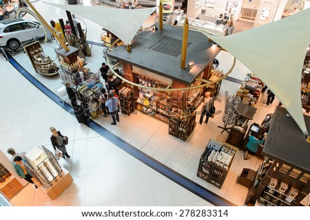 DUBAI - MARCH 10, 2015: The Dubai duty-free shopping area. Dubai International Airport is the primary airport serving Dubai and is the world\'s busiest airport by international passenger traffic