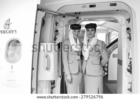 DUBAI - MAY 16: Emirates crew members meet passengers in Airbus A380 aircraft on May 16, 2014 in Dubai, UAE. Emirates handles major part of passenger traffic and aircraft movements at the airport.