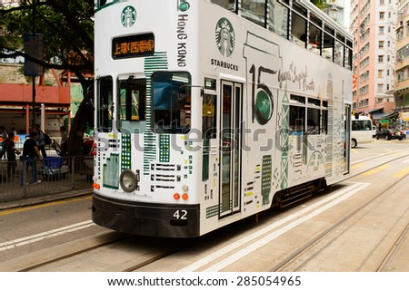 HONG KONG - JUNE 02, 2015: double-decker tram on street of HK. Hong Kong Tramways is a tram system in Hong Kong, being one of the earliest forms of public transport in the metropolis.