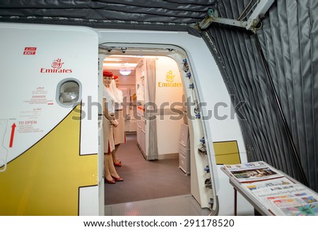 HONG KONG- JUNE 18, 2015: Emirates crew meet passengers on second floor of A380. Emirates is one of two flag carriers of the United Arab Emirates along with Etihad Airways and is based in Dubai