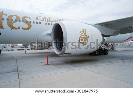 DUBAI, UAE - JUNE 23, 2015: Emirates logo on engine of Boeing 777. Emirates handles major part of passenger traffic and aircraft movements at the airport.