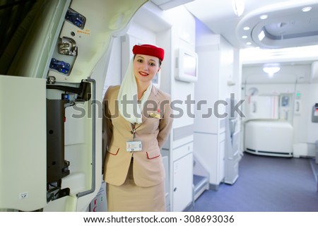DUBAI, UAE - MARCH 10, 2015: Emirates Airbus A380 crew member. Emirates handles major part of passenger traffic and aircraft movements at the airport.