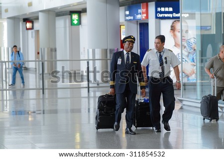 HONG KONG - APRIL 15, 2015: pilots of United Airlines after flight. United Airlines, Inc. is an American major airline headquartered in Chicago, Illinois