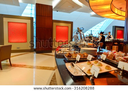 DUBAI - JUNE 23, 2015: Emirates business class lounge interior. Emirates is an airline based in Dubai, United Arab Emirates.